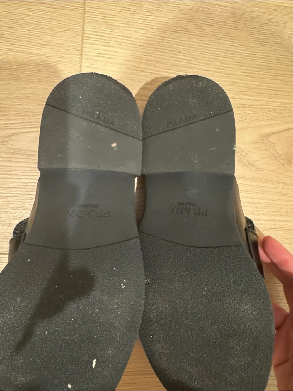 Prada women’s Black Leather Slide Loafers with Triangle Logo